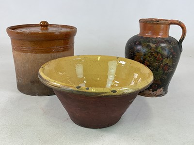 Lot 290 - A large earthenware bowl with yellow glazed...