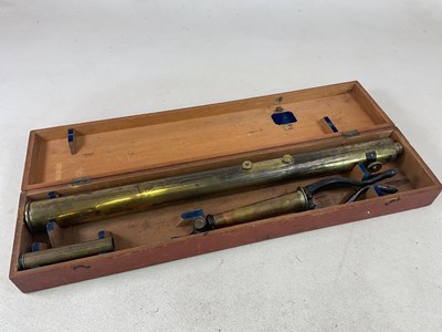 Lot 121 - A brass extending telescope with tripod stand...