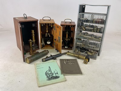 Lot 104 - Quantity of brass microscopes, lenses, cases...