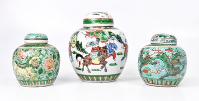 Lot 407 - Three Famille Verte lidded ginger jars, one...