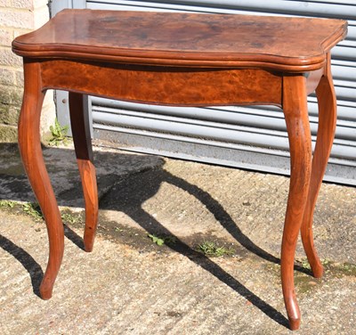 Lot 91 - A burr walnut fold over card table, width 84cm.