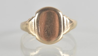 Lot 1282 - A 9ct gold signet ring with blank oval table,...