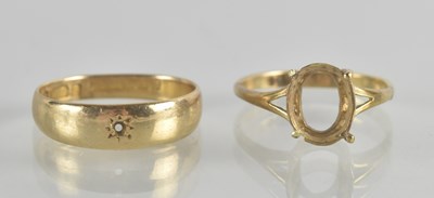 Lot 1322 - Two 9ct gold rings comprising a band ring with...