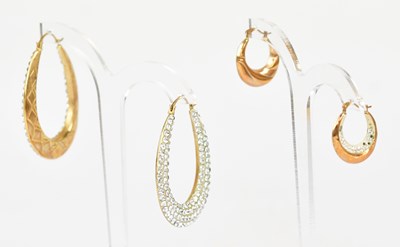 Lot 876 - A large pair of 9ct yellow gold hoop earrings...