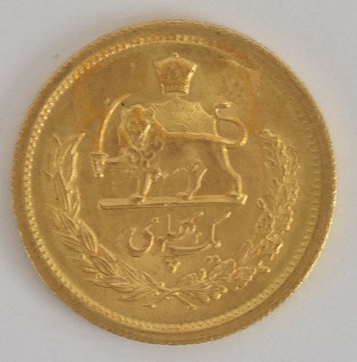 Lot 1605 - A Persian one Pahlavi gold coin, 1917, bearing...
