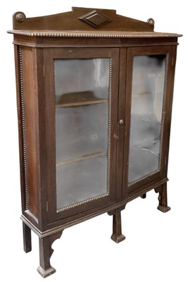 Lot 32 - A 1920s oak bookcase, with pair of glazed...