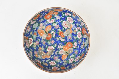 Lot 1556 - A Japanese Famille Rose footed bowl, decorated...