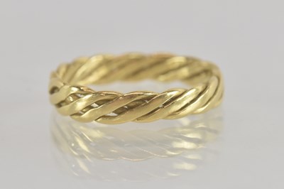 Lot 1344 - An 18ct gold flat twist band ring, size M,...
