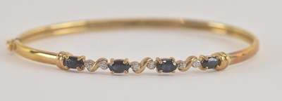 Lot 1522 - A 9ct gold diamond and sapphire set bracelet,...