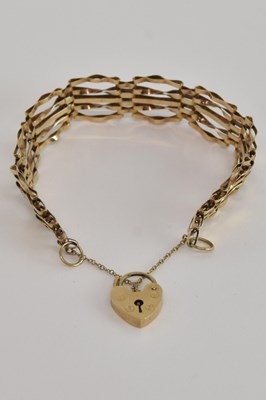 Lot 1517 - A 9ct gold five bar gate link bracelet, united...