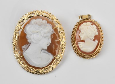Lot 84 - A yellow metal mounted cameo style brooch, the...