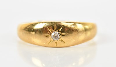 Lot 438 - A yellow metal diamond set ring, size K,...
