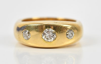 Lot 350 - A yellow metal diamond set three stone dress...