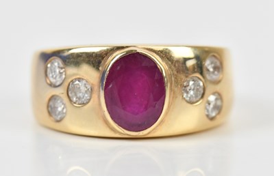Lot 364 - A yellow metal dress ring, set with an oval...