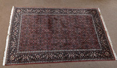 Lot 2665 - A Persian wool rug, worked with an all over...