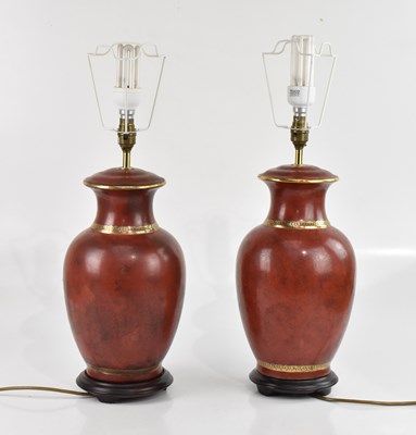 Lot 1821 - A pair of modern red lamps, height 60cm.