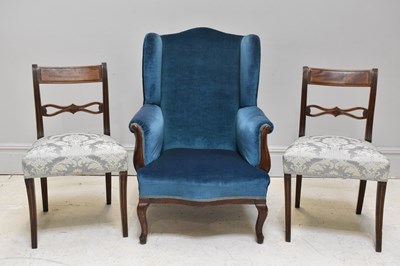 Lot 1135 - An Edwardian upholstered wing armchair, a pair...