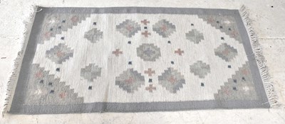 Lot 1259 - A hand knotted light blue ground rug, 140 x 83cm.