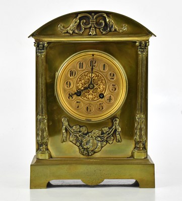 Lot 1280 - A brass cased mantel clock with gilt face,...