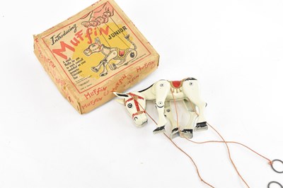 Lot 1428 - A boxed Muffin Junior metal mule puppet, 14cm.