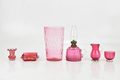 Lot 1732 - A collection of cranberry glass including oil...