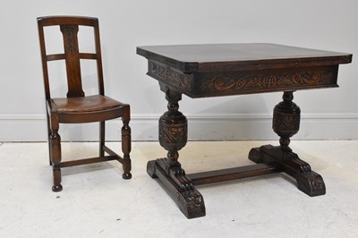 Lot 1045 - A reproduction carved oak draw-leaf table,...