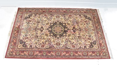 Lot 1254 - A modern red ground Keshan carpet, 303 x 200cm.