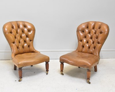 Lot 1099 - A pair of late 19th century tan leather club...