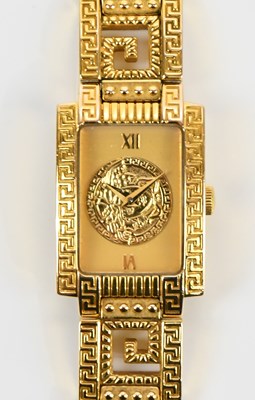 Lot 650 - GIANNI VERSACE; a gold plated Swiss quartz...