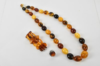 Lot 120 - An amber bead necklace, length 70cm, an amber...