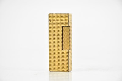 Lot 708 - DUNHILL; a gold plated textured lighter,...