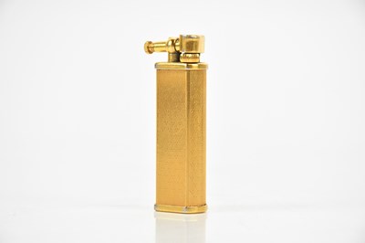 Lot 667 - DUNHILL; a gold plated flip-top lighter, no....