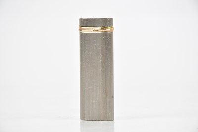 Lot 668 - CARTIER; a Trinity lighter, no. 75245E,...