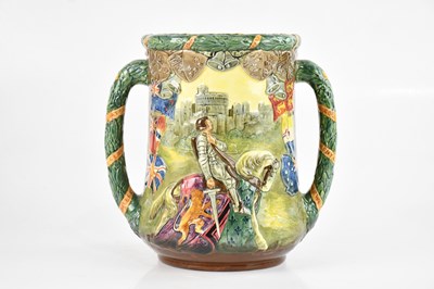 Lot 1568 - ROYAL DOULTON; a large loving cup produced to...