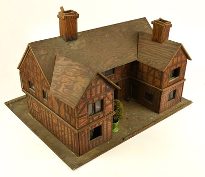 Lot 33 - A bespoke pitch pine doll's house, modelled as...