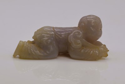 Lot 33 - A Chinese mutton fat jade carving of a male...
