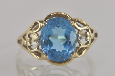 Lot 1318 - A 9ct gold blue stone and tiny diamond set...