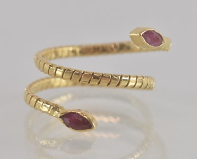 Lot 1354 - A gold coloured metal ring in the form of a...