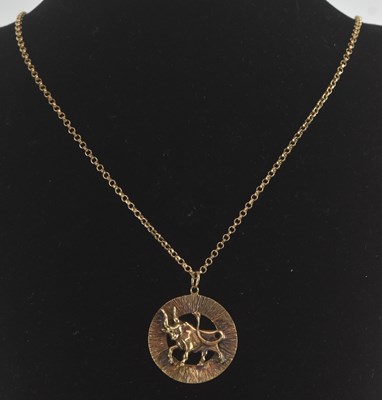 Lot 1372 - A 9ct yellow gold zodiac Taurus circular...