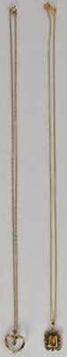Lot 1404 - A 9ct yellow gold citrine set pendant, the...