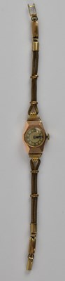 Lot 1722 - A 9ct yellow gold lady's wristwatch, on gold...
