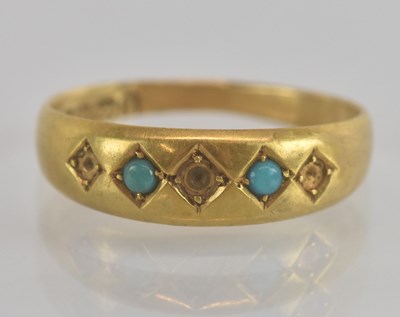 Lot 1255 - An 18ct yellow gold turquoise set ring, set...