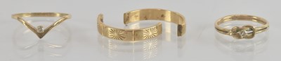 Lot 1266 - A 9ct yellow gold white stone set dress ring,...