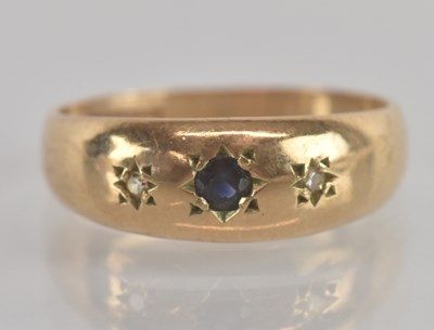 Lot 1300 - A 9ct yellow gold sapphire and diamond set...