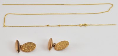 Lot 1211 - A pair of 9ct yellow gold oval cufflinks and a...