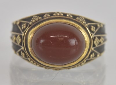 Lot 1243 - A white and yellow metal cabochon agate set...