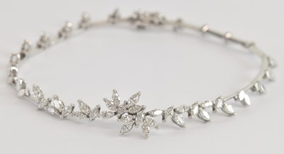 Lot 1491 - An 18ct white gold diamond set bracelet, set...