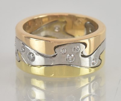 Lot 1219 - IN THE MANNER OF GEORG JENSEN; An 18ct yellow...