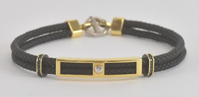 Lot 1495 - An 18ct yellow gold mounted black leather...