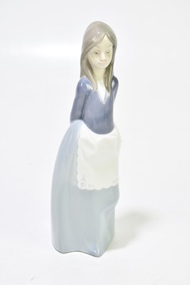 Lot 522 - NAO; four assorted figures to include a girl...